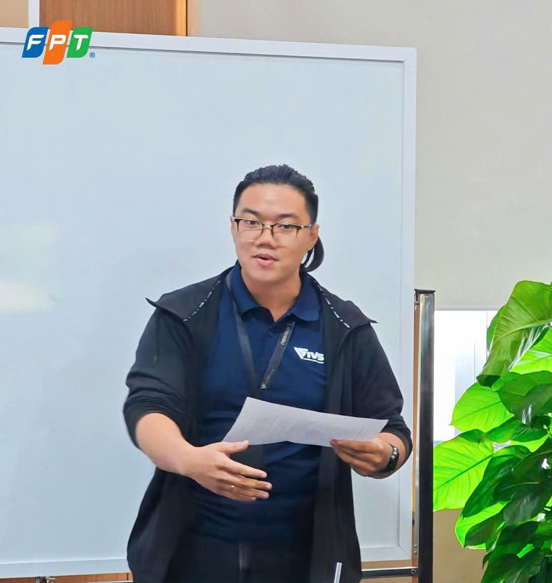 Tran Quoc Truong pitching the Agent Assurance engine on stage